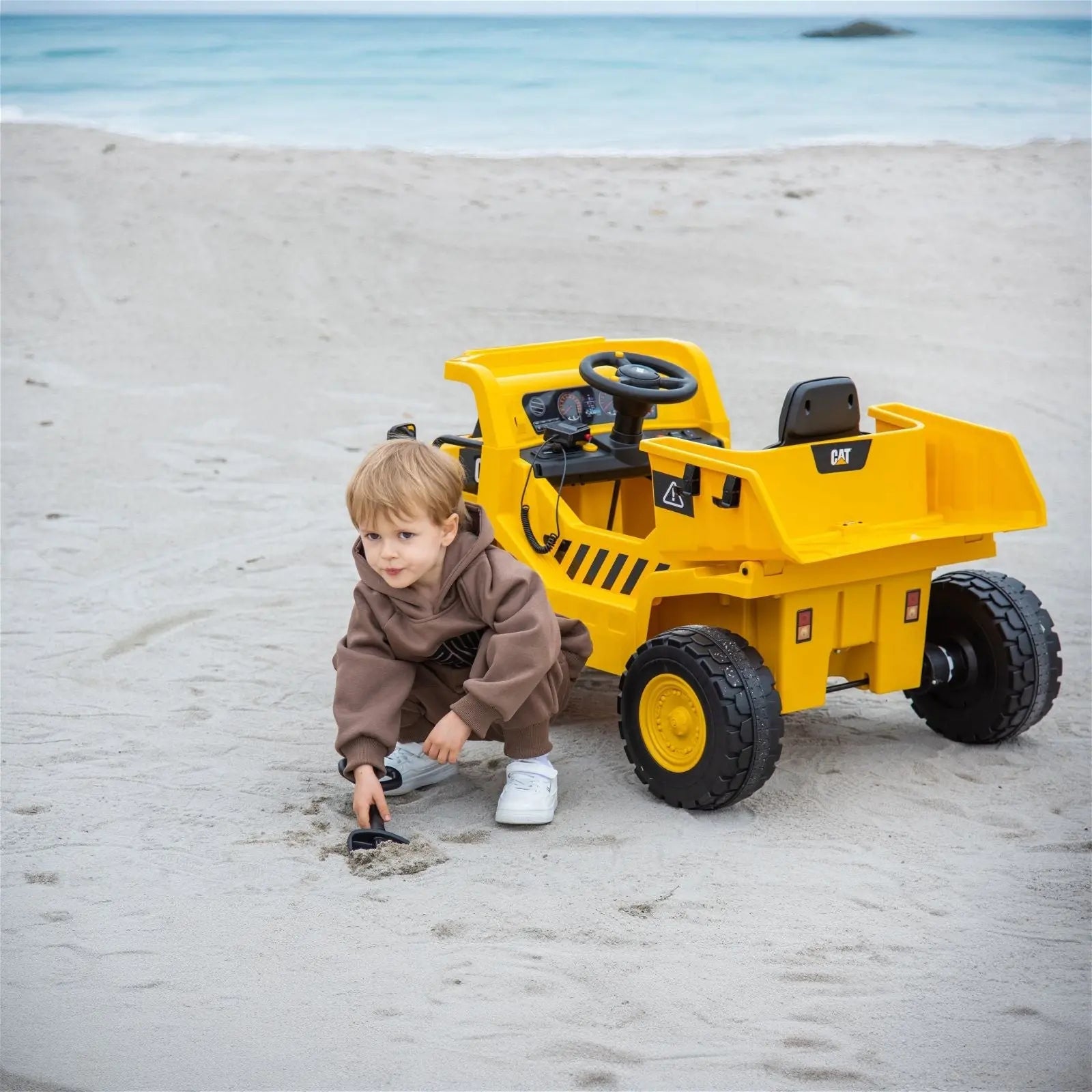 12V CAT Electric Dump Truck 1 Seater Ride-On – front three-quarter view | Freddo Toys Canada