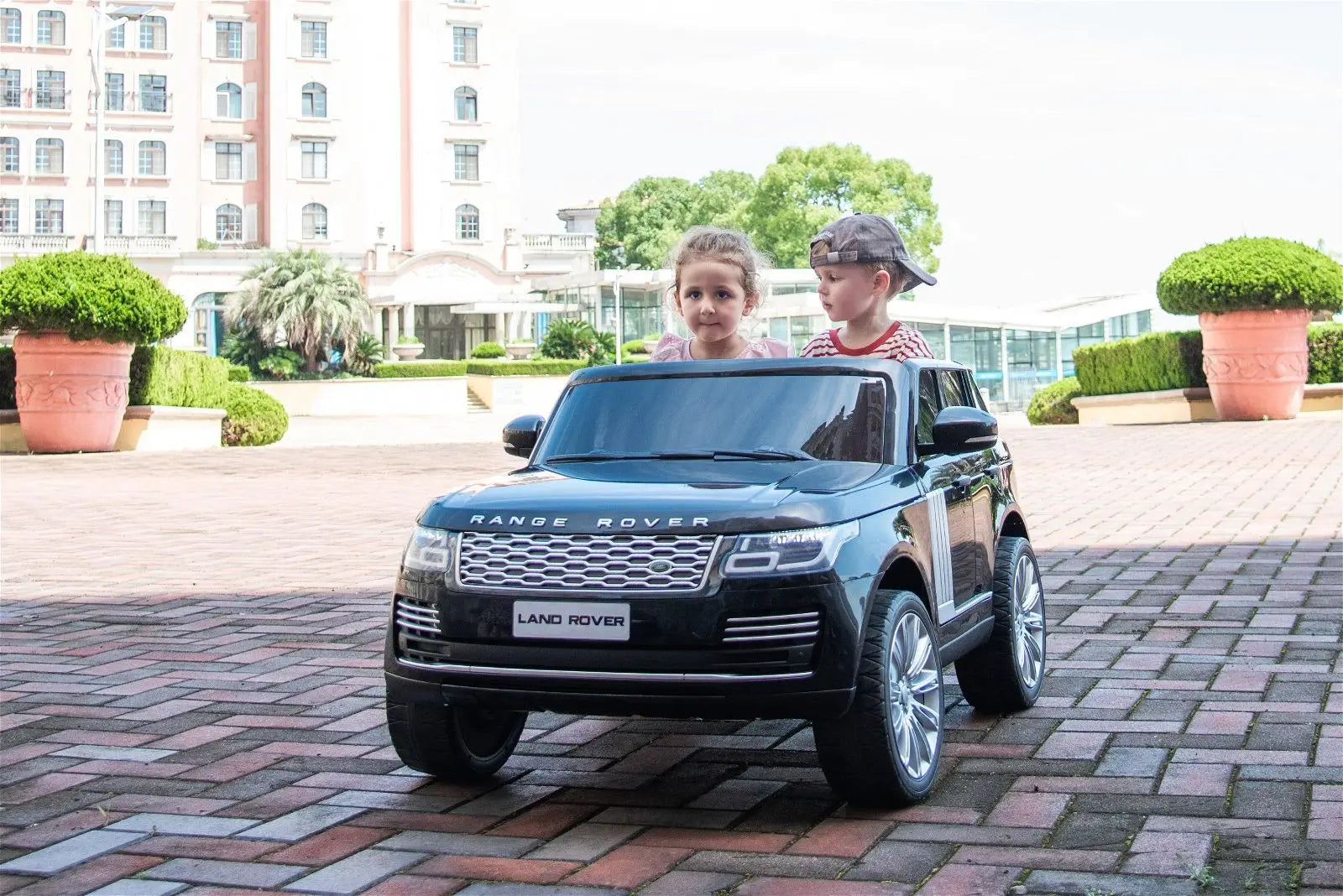 Child riding the 24V Range Rover HSE 2 Seater Ride on | Freddo Toys Canada