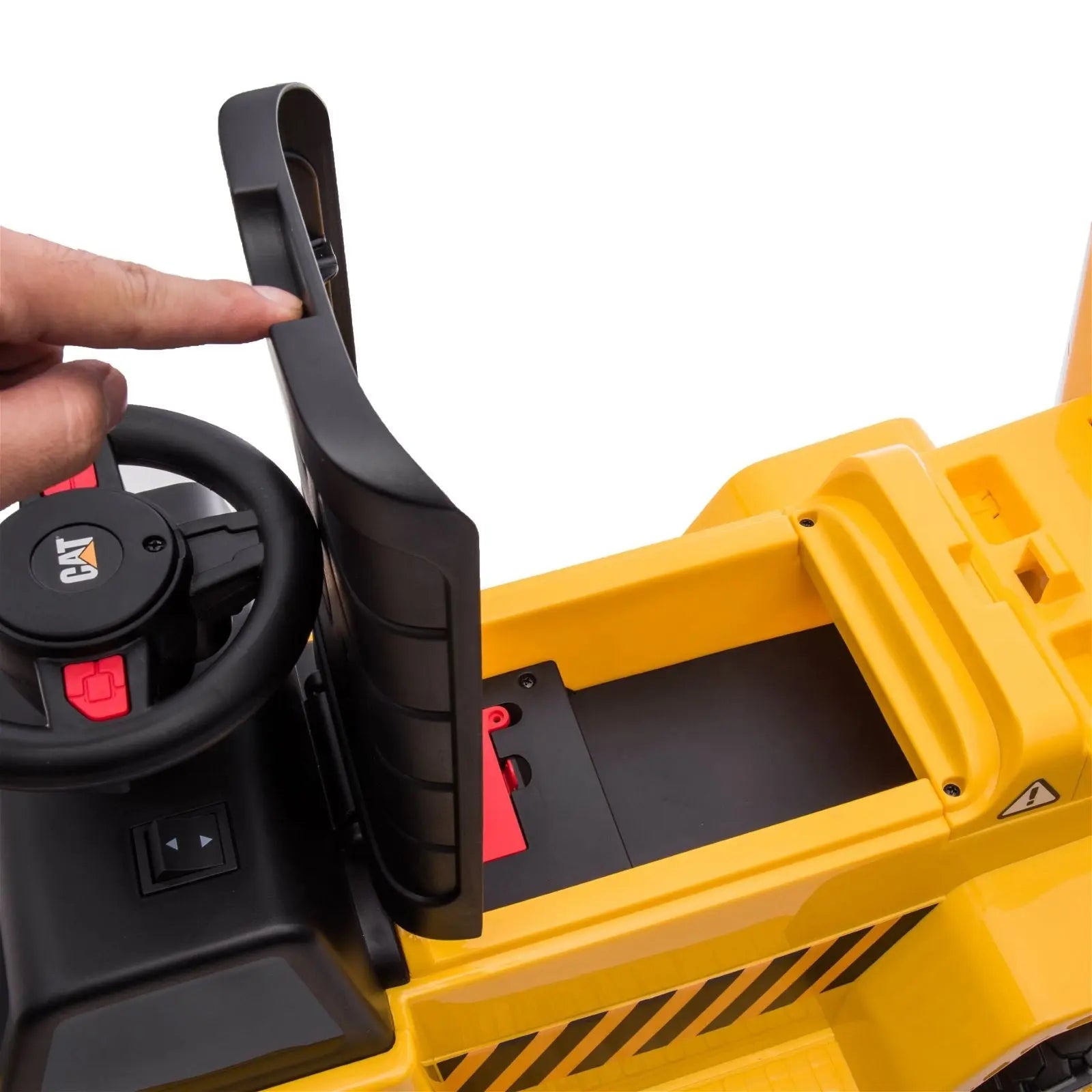 Child riding the 6V CAT Dump Truck Ride-On Toy | Freddo Toys Canada