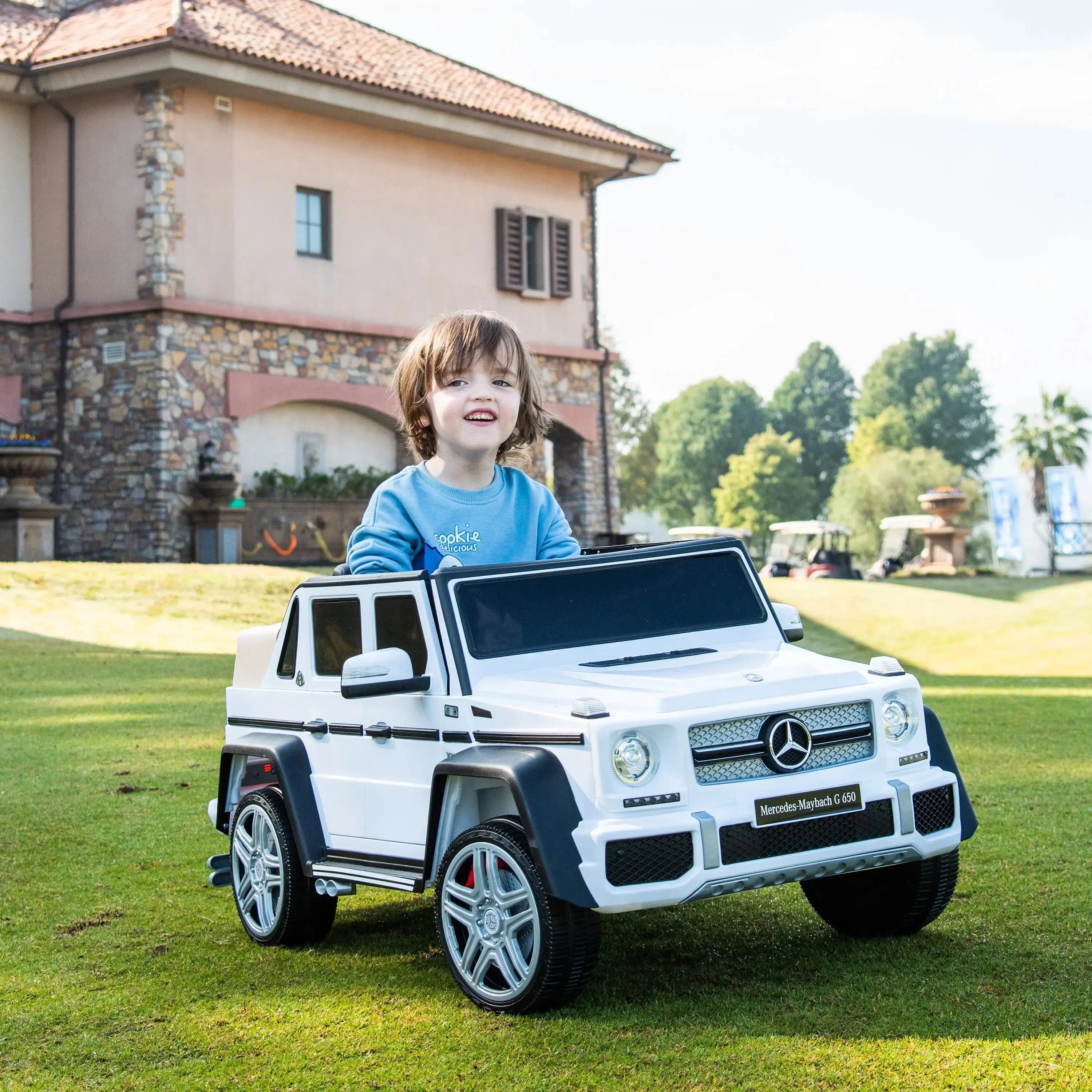 Child riding the 12V Mercedes Maybach G650 1 Seater (2) | Freddo Toys Canada